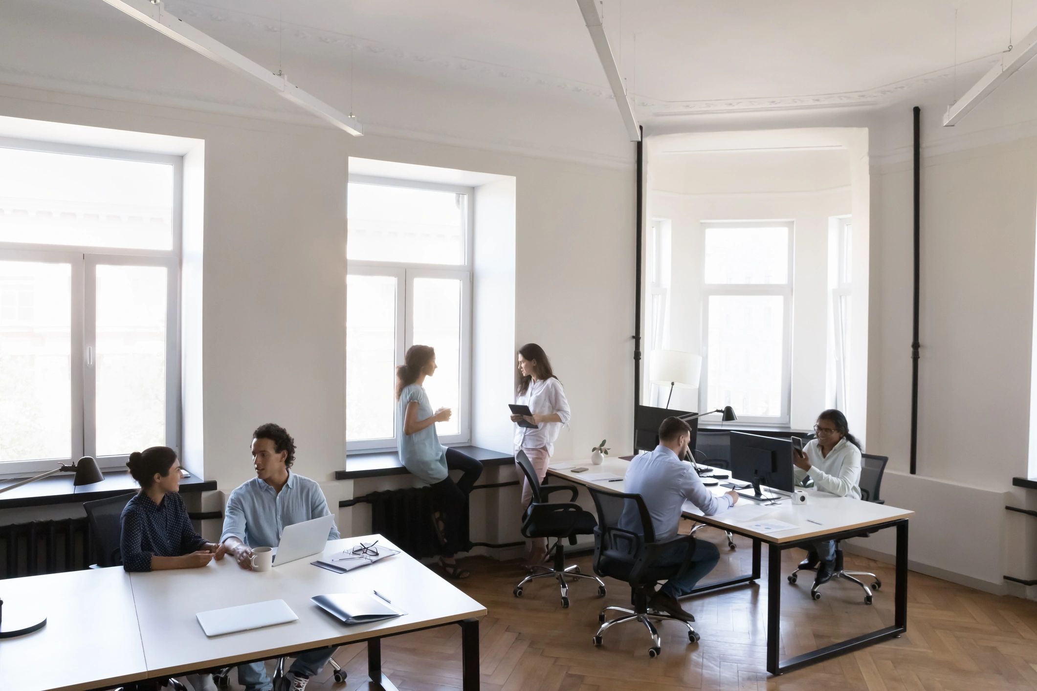 Professional team collaborating in a modern workspace